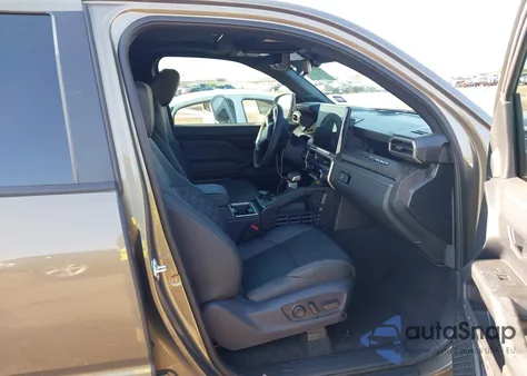 2025 Toyota Tacoma Hybrid Limited from USA, damaged, VIN 3TYLC5LN0ST040026